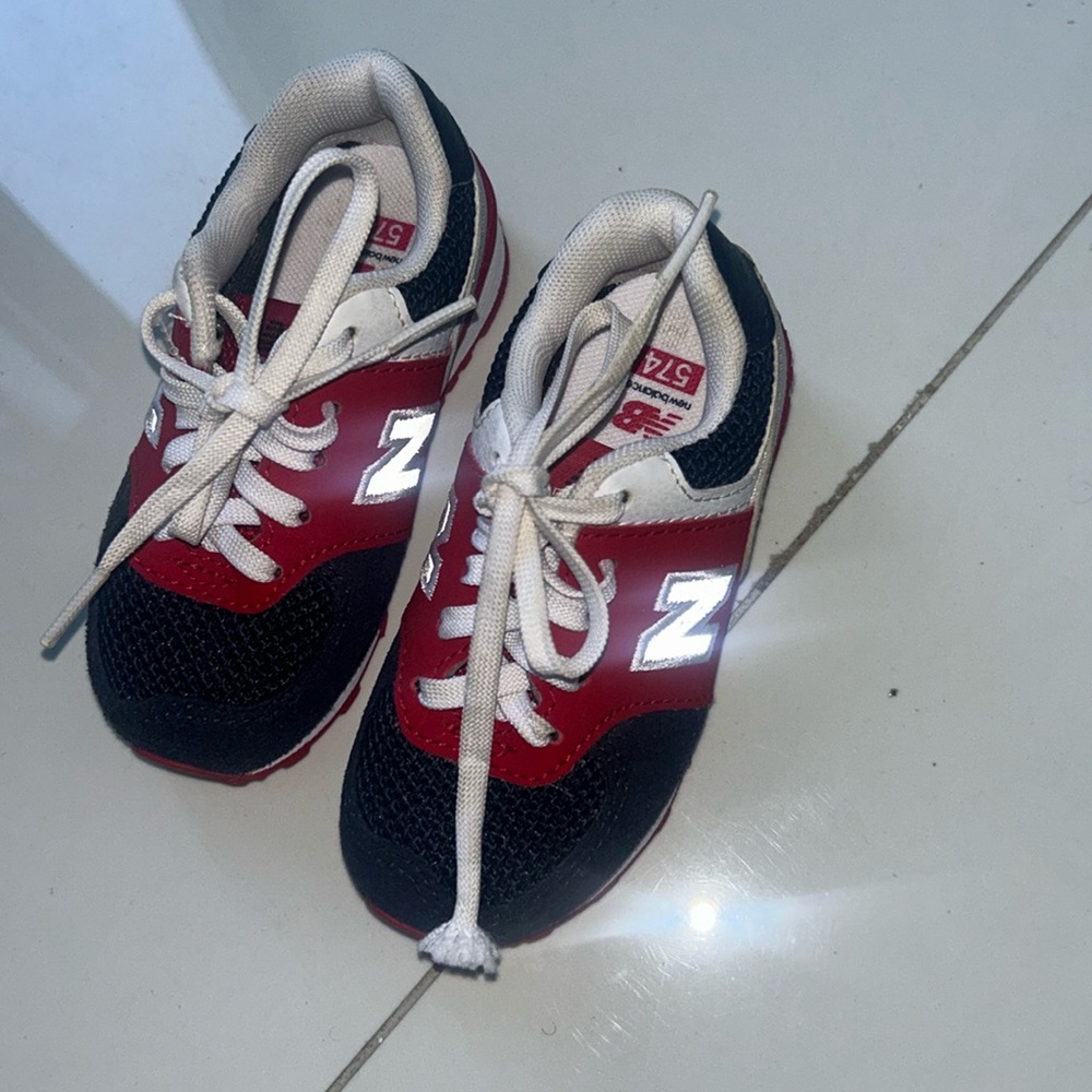 New Balance Toddler shoes. Size 6.5. Colors: red, white and blue